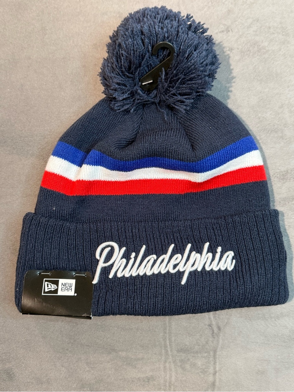 New Era Navy Pom Beanie with Red, White & Blue Stripes - Philadelphia Script